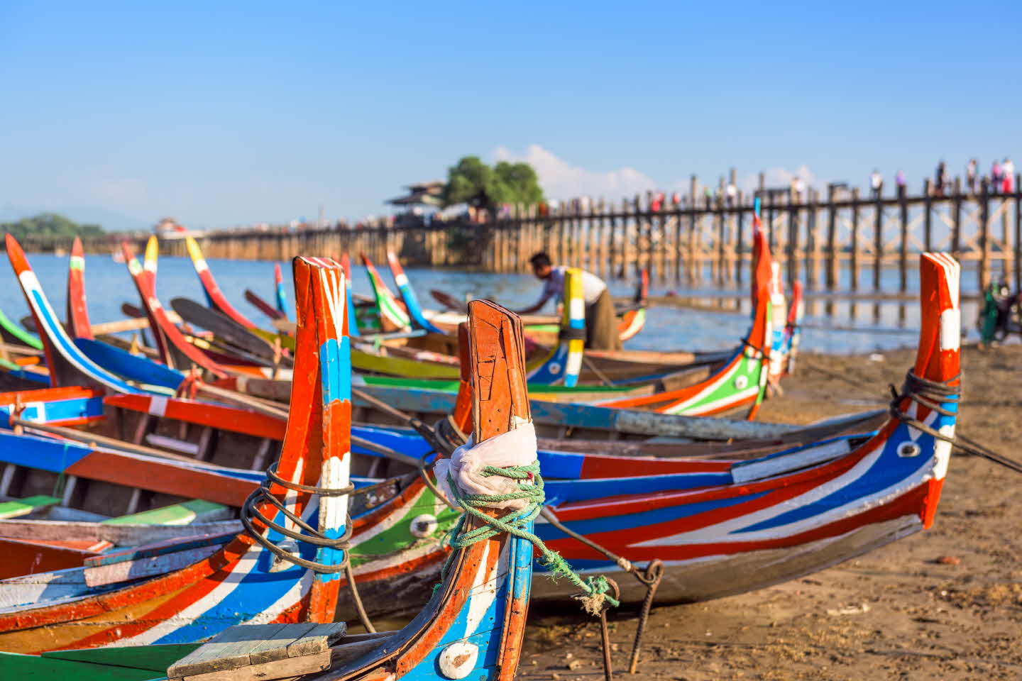 Mandalay, Myanmar boats on the Taungthaman Lake in front of U Bein Bridge.